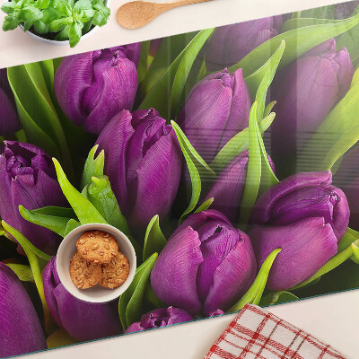 Glass kitchen board Purple tulips with green leaves