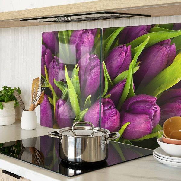 Glass kitchen board Purple tulips with green leaves