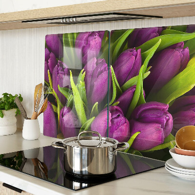 Glass kitchen board Purple tulips with green leaves
