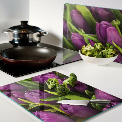 Glass kitchen board Purple tulips with green leaves