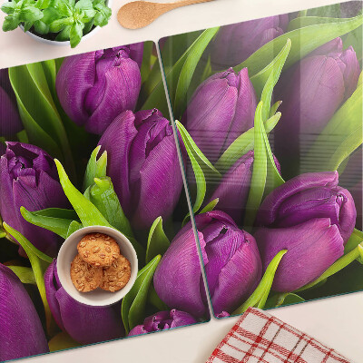 Glass kitchen board Purple tulips with green leaves