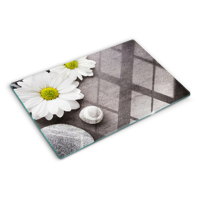 Chopping board Flowers and stones in the background