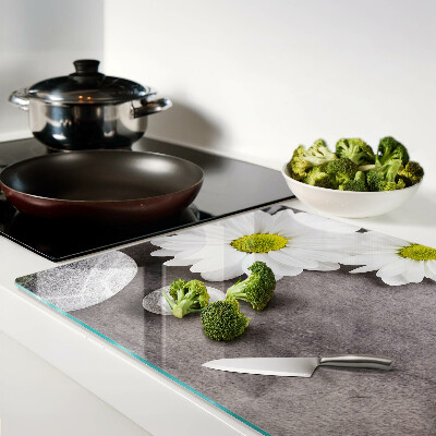 Chopping board Flowers and stones in the background