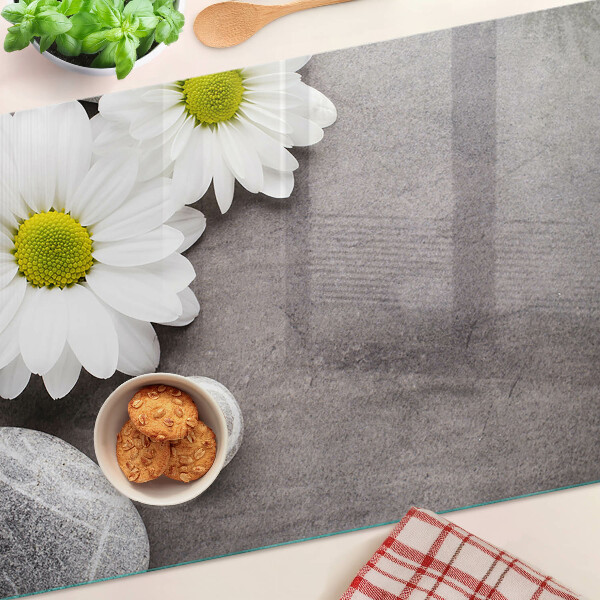 Chopping board Flowers and stones in the background