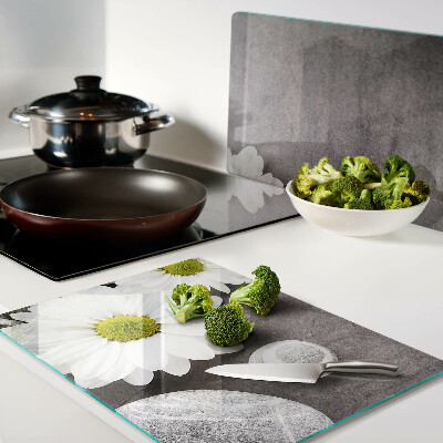 Chopping board Flowers and stones in the background
