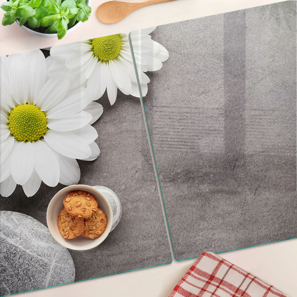 Chopping board Flowers and stones in the background