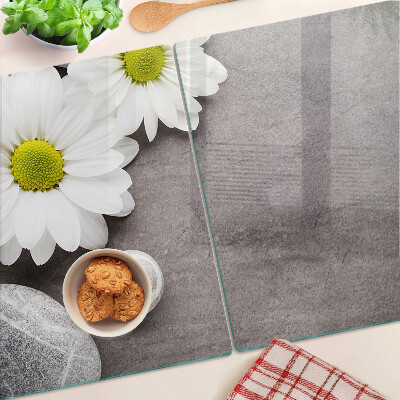 Chopping board Flowers and stones in the background