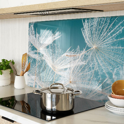 Chopping board glass Dandelions on a blue background