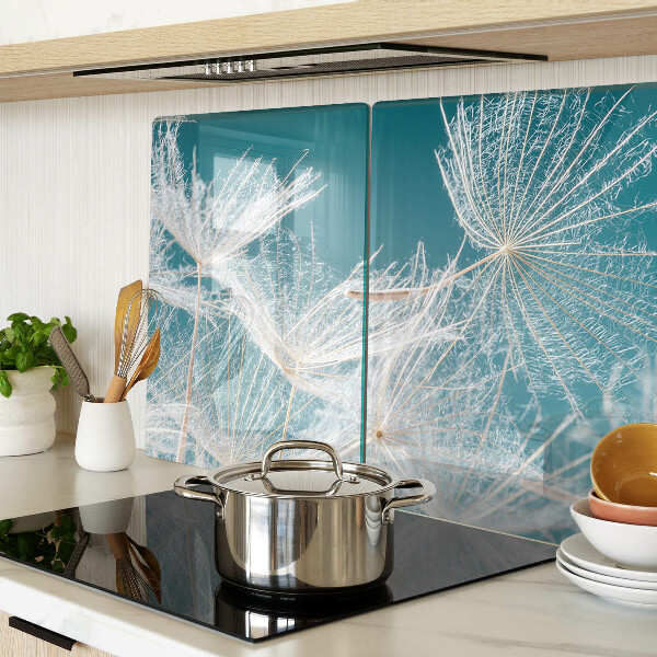 Chopping board glass Dandelions on a blue background