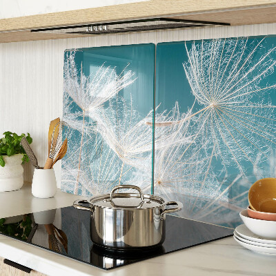 Chopping board glass Dandelions on a blue background