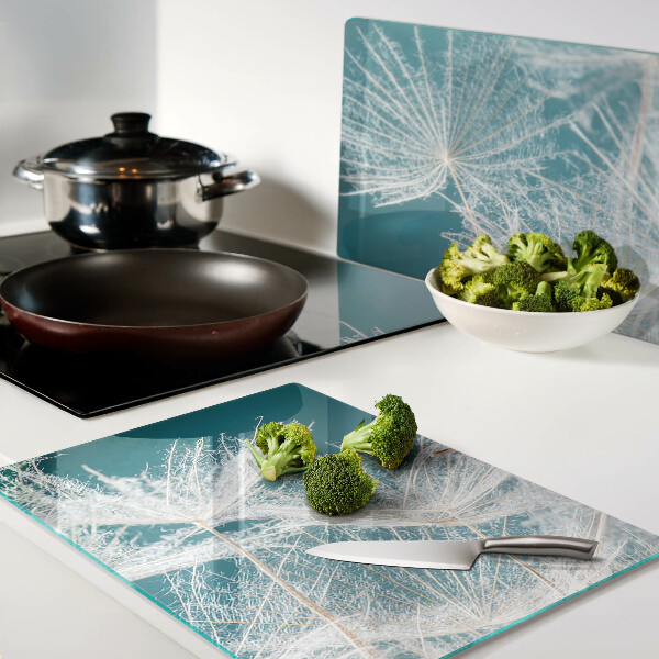 Chopping board glass Dandelions on a blue background