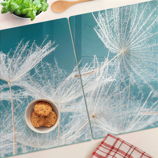 Chopping board glass Dandelions on a blue background
