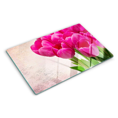 Glass chopping board Tulip flowers on a pink background