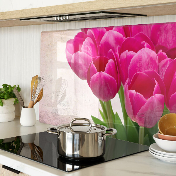 Glass chopping board Tulip flowers on a pink background