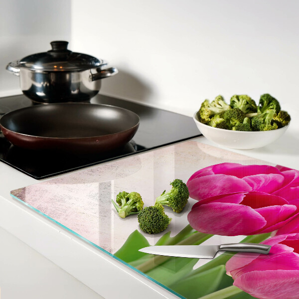 Glass chopping board Tulip flowers on a pink background