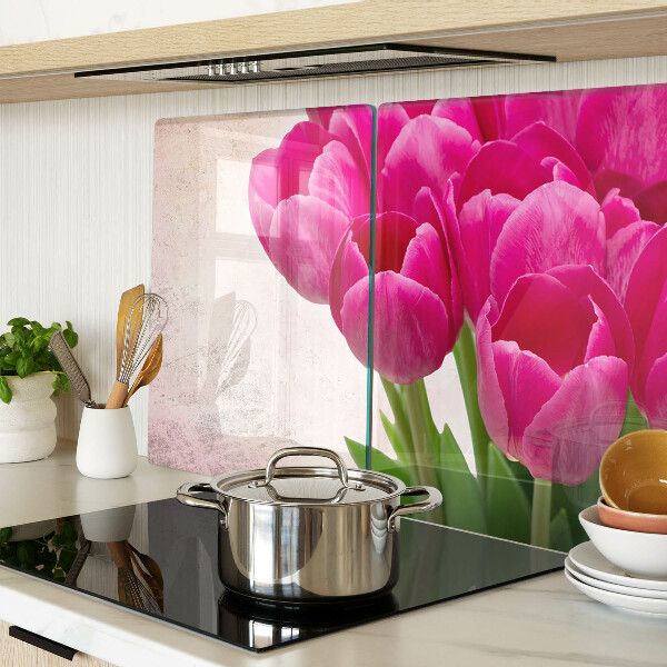 Glass chopping board Tulip flowers on a pink background