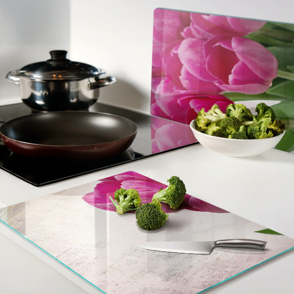 Glass chopping board Tulip flowers on a pink background