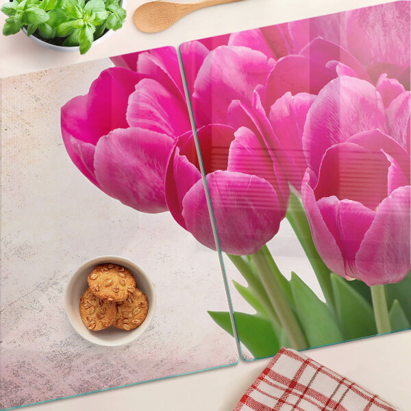 Glass chopping board Tulip flowers on a pink background