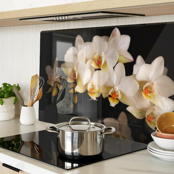 Chopping board glass Orchids on a black background