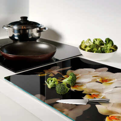 Chopping board glass Orchids on a black background