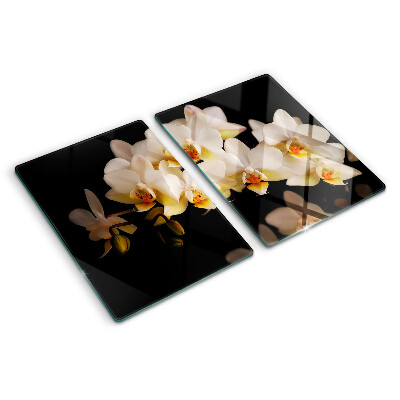Chopping board glass Orchids on a black background
