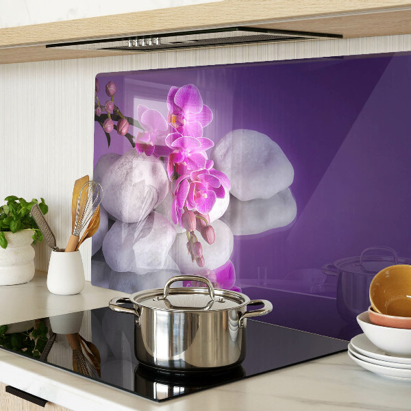 Cutting board Orchid flowers on a background of stones