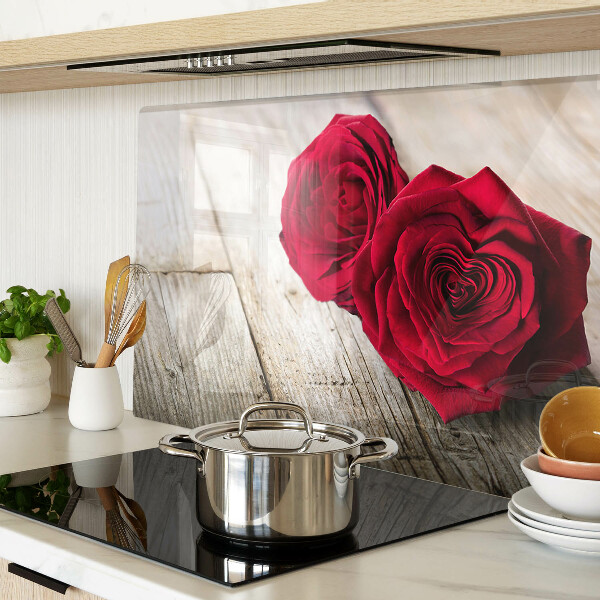 Glass chopping board Red roses on a wooden background
