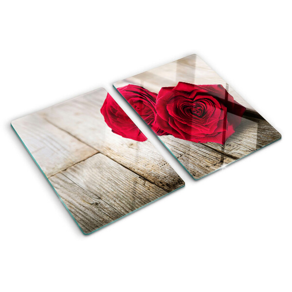 Glass chopping board Red roses on a wooden background