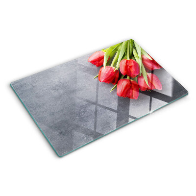 Glass cutting board Tulips on a gray background