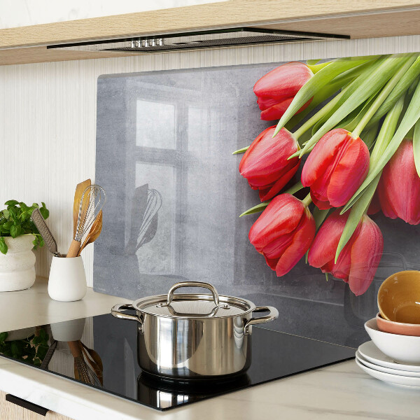 Glass cutting board Tulips on a gray background