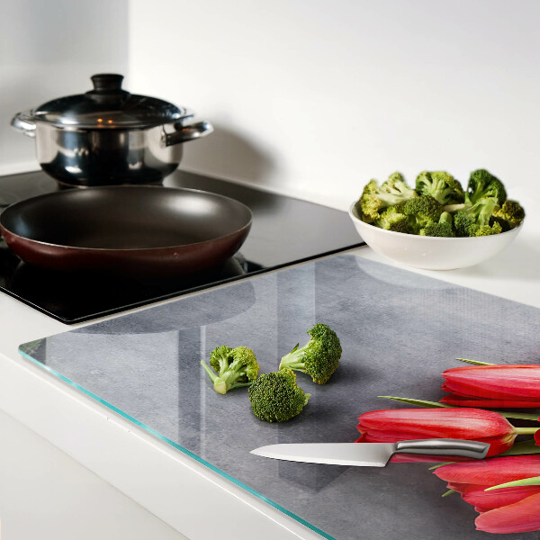 Glass cutting board Tulips on a gray background