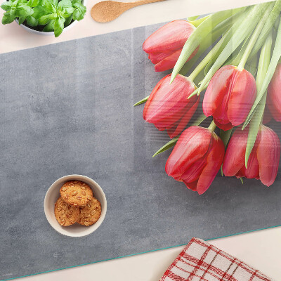 Glass cutting board Tulips on a gray background