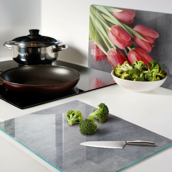 Glass cutting board Tulips on a gray background