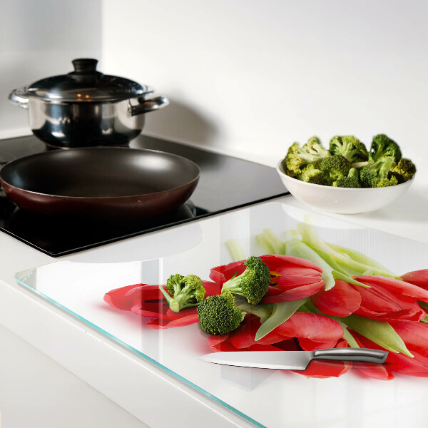 Glass kitchen board Red tulips on a white background