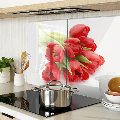 Glass kitchen board Red tulips on a white background
