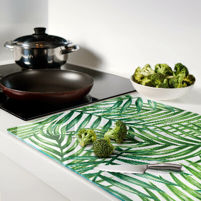 Glass kitchen board Palm leaves in shades of green