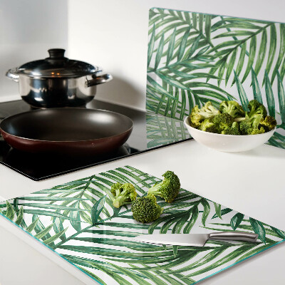 Glass kitchen board Palm leaves in shades of green