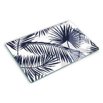 Chopping board glass Palm leaves on a white background