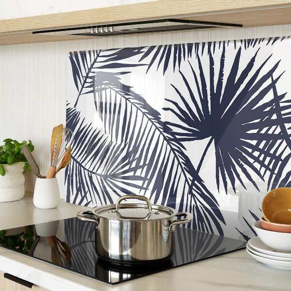 Chopping board glass Palm leaves on a white background