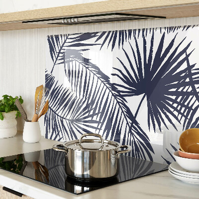 Chopping board glass Palm leaves on a white background