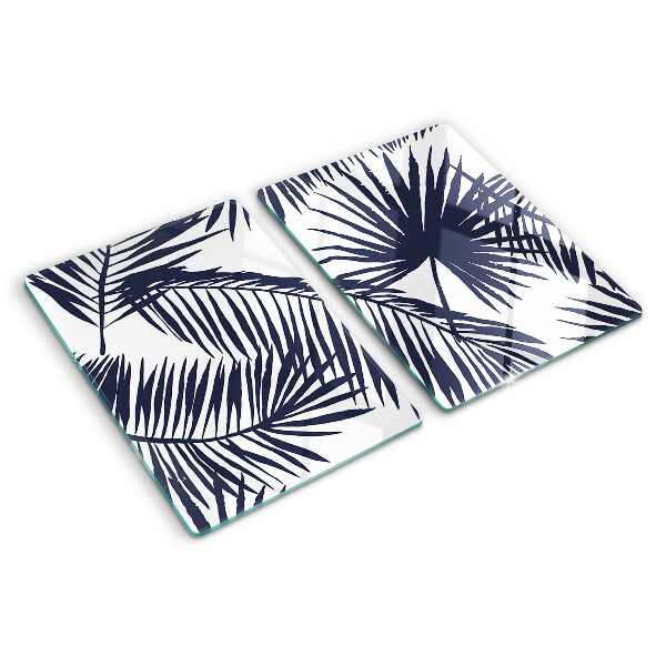 Chopping board glass Palm leaves on a white background