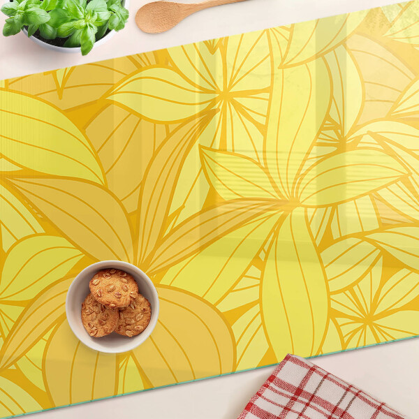 Chopping board glass Yellow leaves in a tropical style