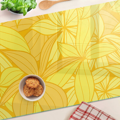 Chopping board glass Yellow leaves in a tropical style