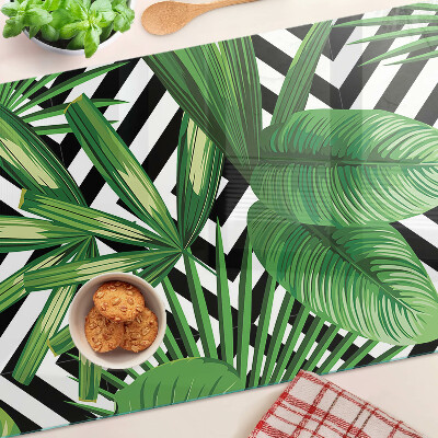 Glass kitchen board Tropical leaves on stripes