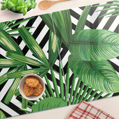 Glass kitchen board Tropical leaves on stripes