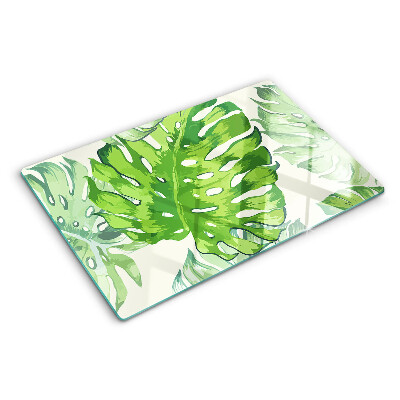 Glass kitchen board Monstera leaves on a light background