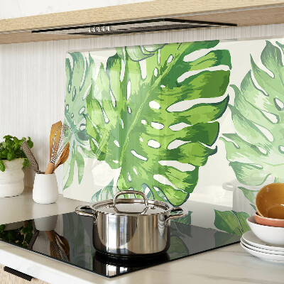 Glass kitchen board Monstera leaves on a light background