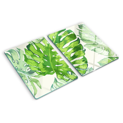 Glass kitchen board Monstera leaves on a light background