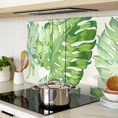 Glass kitchen board Monstera leaves on a light background