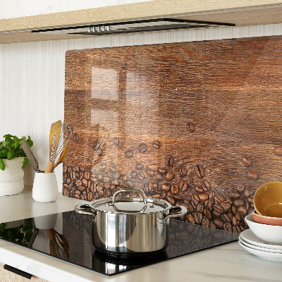 Chopping board glass Coffee beans on a wooden background